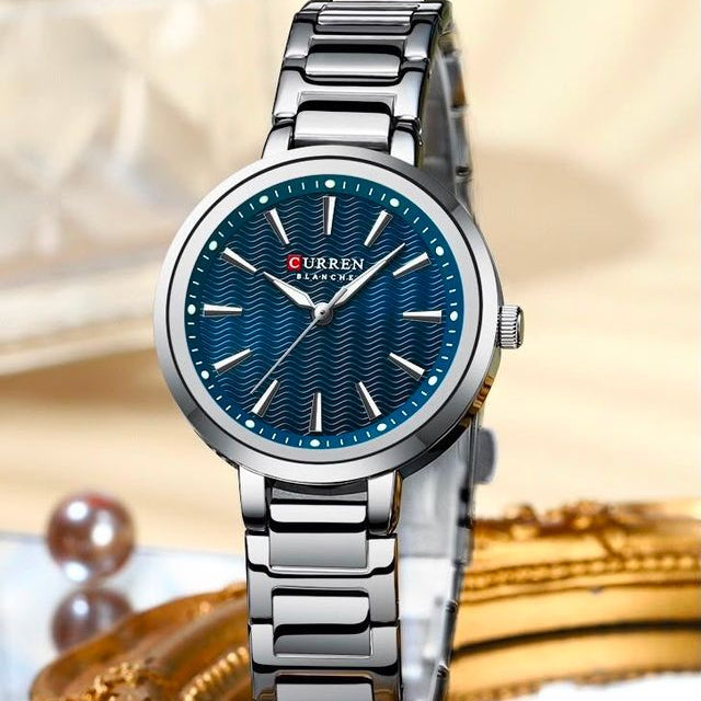 Reloj CURREN Blanche para Mujer – Elegancia Plateada con Esfera Azul Texturizada
