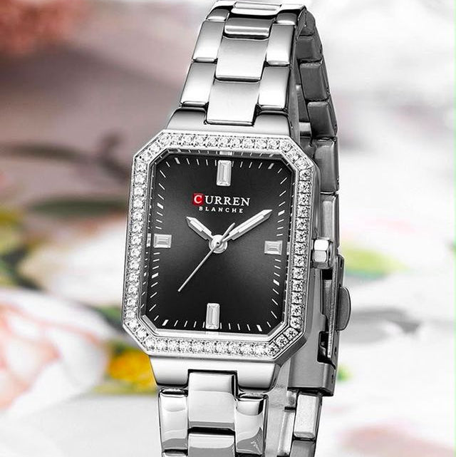 Reloj CURREN Blanche para Mujer – Elegancia Plateada con Esfera Negra y Bisel con Cristales