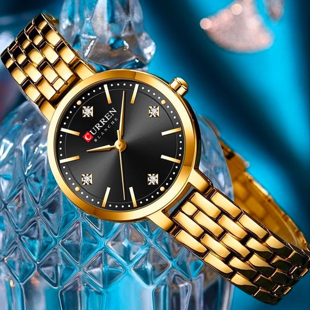 Reloj CURREN Blanche para Mujer – Elegancia Dorada con Esfera Negra y Cristales Decorativos