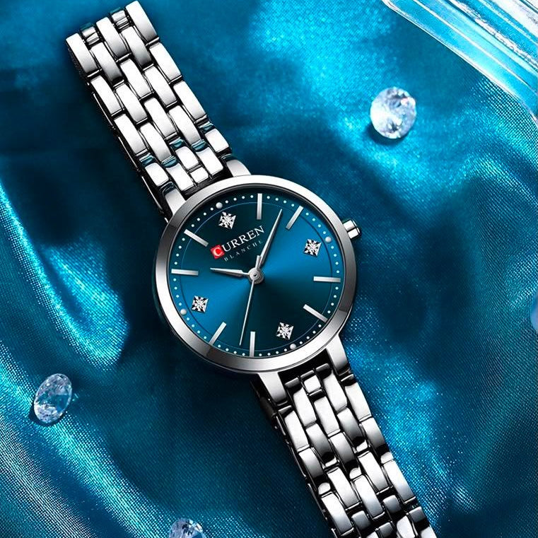 Reloj CURREN Blanche para Mujer – Elegancia Plateada con Esfera Azul Turquesa