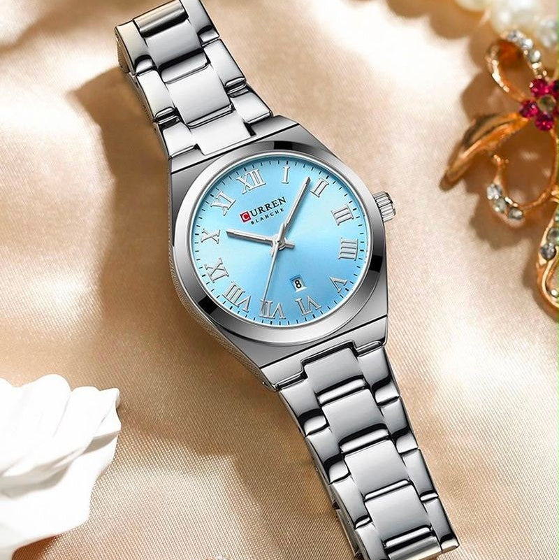 Reloj CURREN Blanche para Mujer – Acero Inoxidable Plateado con Esfera Azul Cielo y Calendario