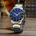 Reloj CURREN para Hombre Bicolor Plata/Dorado – Esfera Azul con Calendario
