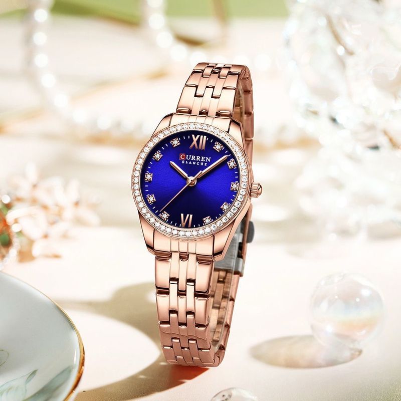 Reloj CURREN Blanche para Mujer – Elegancia Rose Gold con Esfera Azul y Cristales Brillantes